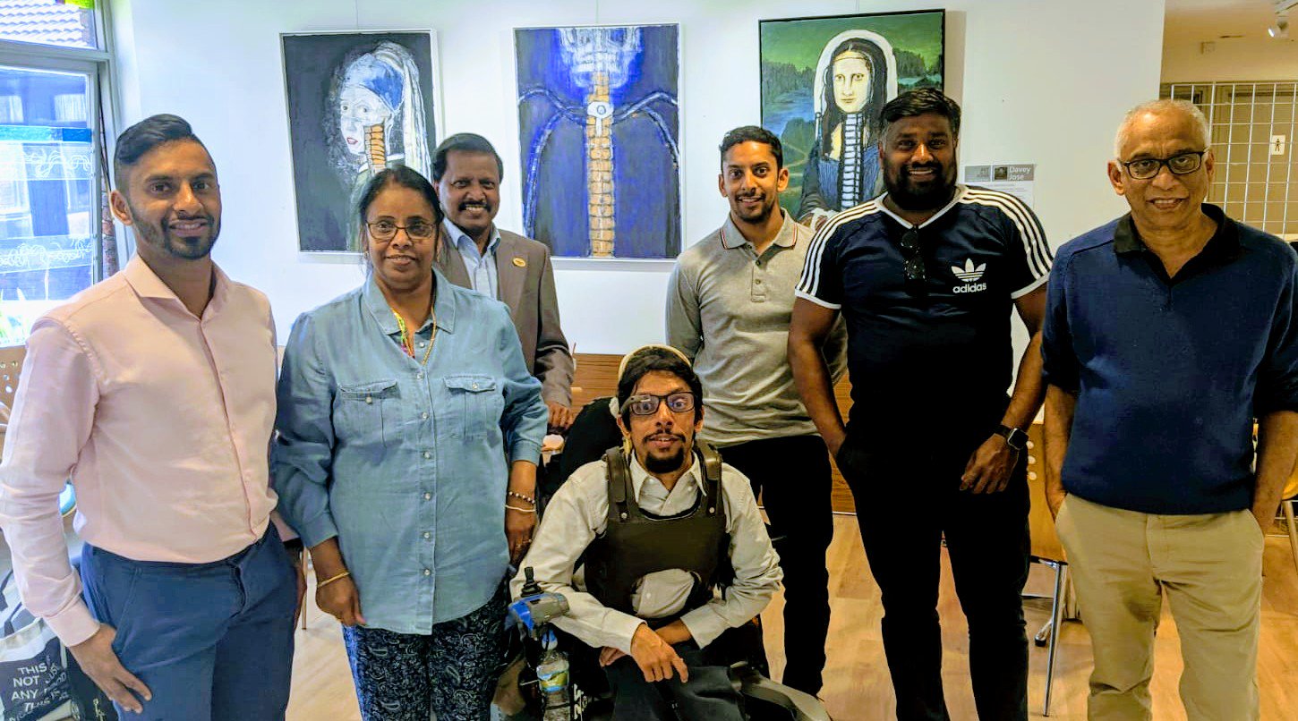 Davey Jose with family at his exhibition at the National Spinal Injuries Centre
