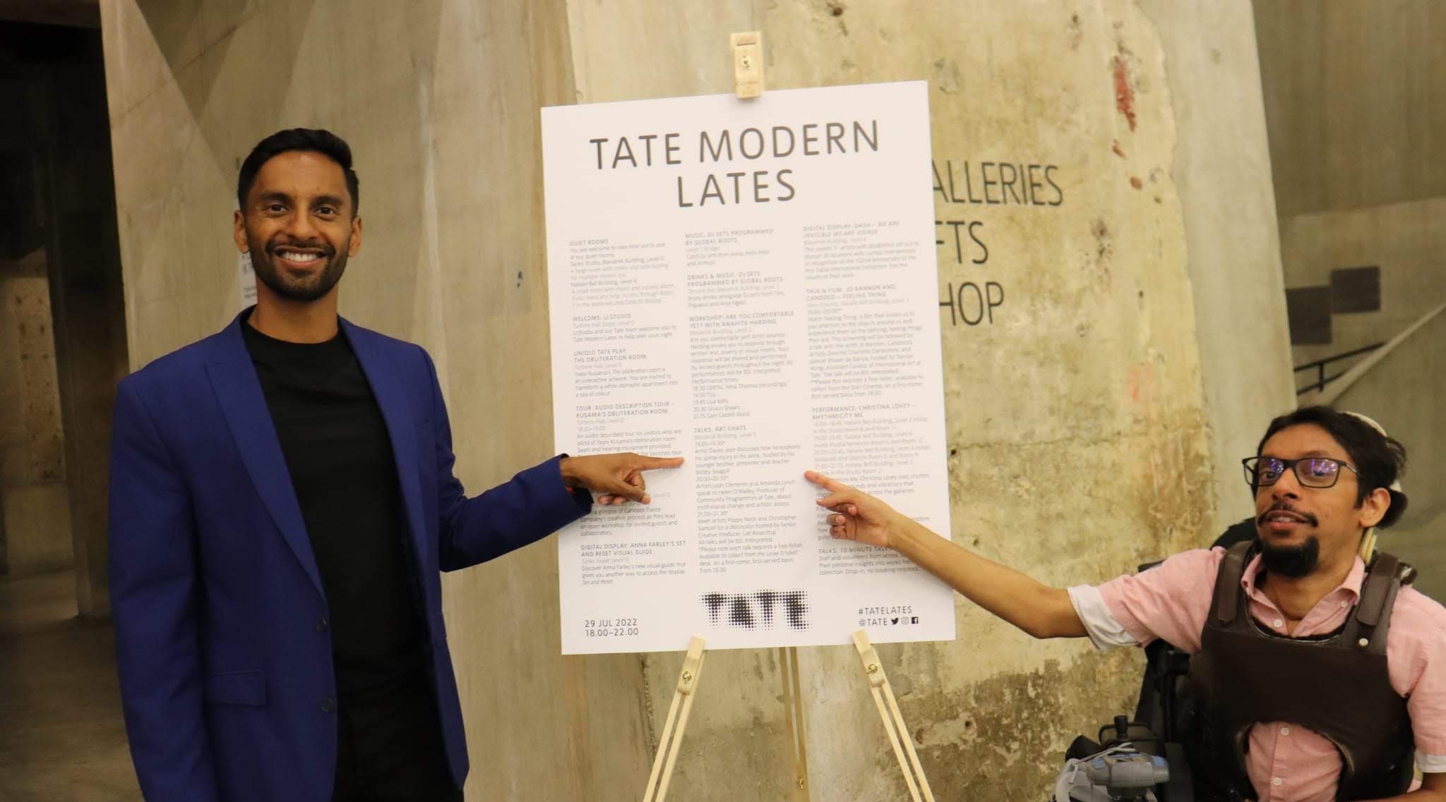 Davey Jose and Bobby Seagull pointing to the talk listing on the Tate Modern Lates programme